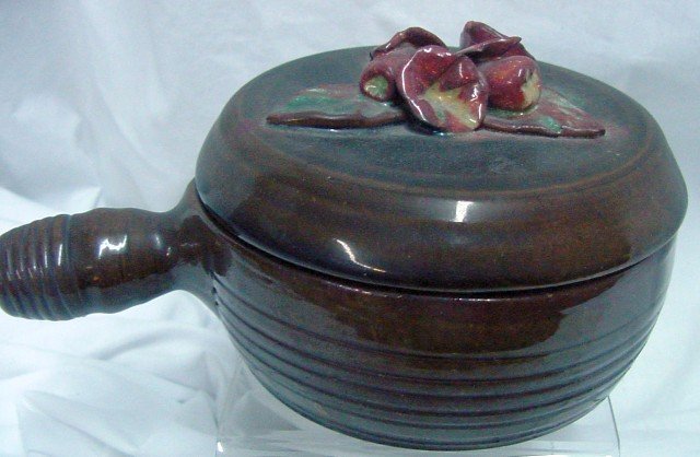 Merritt Island Potters Covered Soup Bowl: Floral crest on the fitted lid, signed with incised signature of Merritt Island Pottery, attached handle, probably 1970s era, 6 1/2" including the handle by 3 1/2" tall.