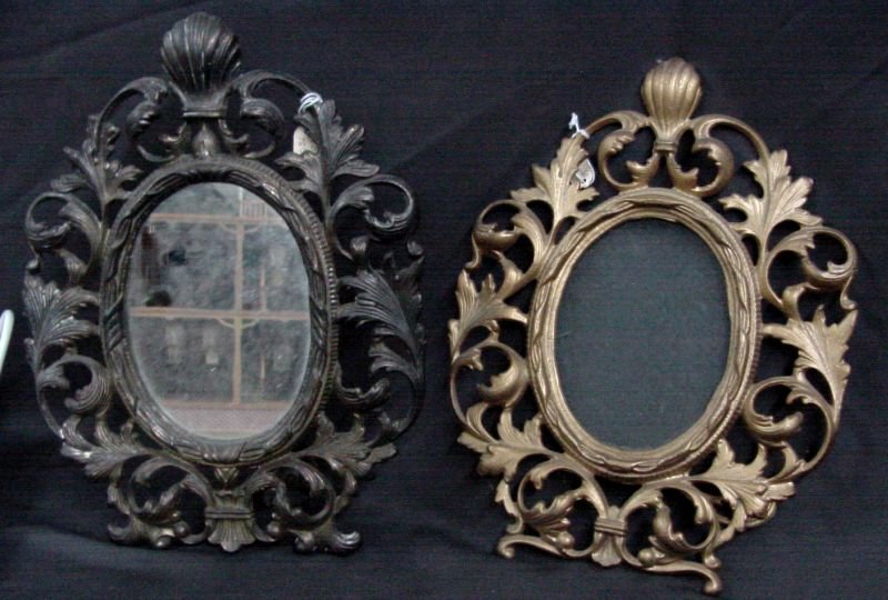 Close Pr. Victorian Brass Picture Frames: There is a small decorative floral blossom below the center of one frame, otherwise, this is a pair, opening size is 5" wide by 6" tall, overall sizes are 11 1/2" tall by 8 1/2" wide. One has been pai