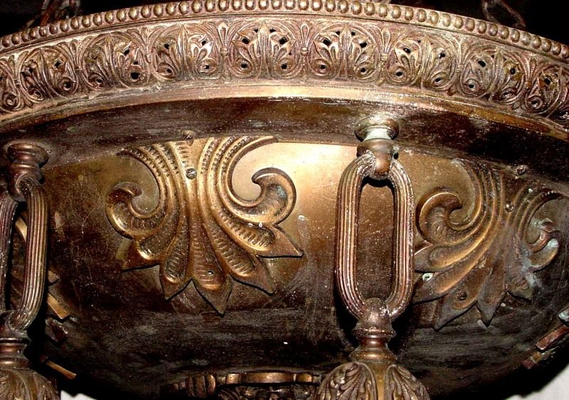 Ornate 1910 8 Light Ceiling Brass/Bronze Chandelier: Probably weighing some 30+ pounds, either brass or bronze, 8 hanging light fixtures, all original chain and ball decorations, applied floral trim, stylized acanthus leaves and rope trim, probably from