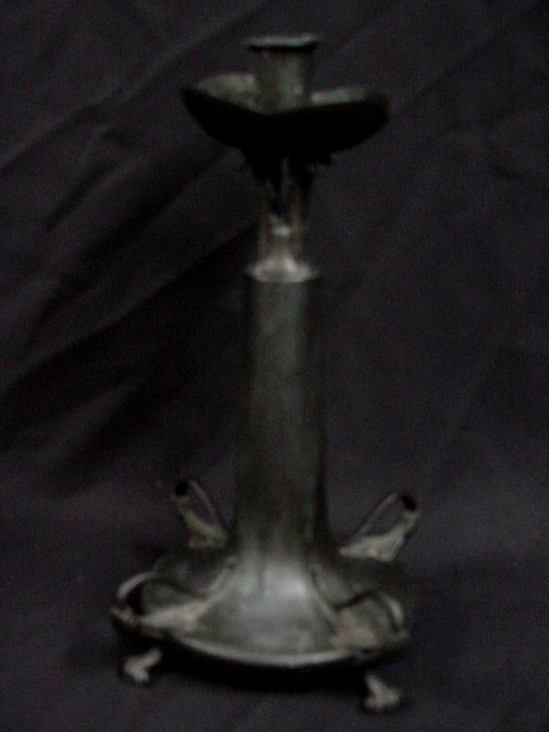 Pairpoint Art Nouveau Candlestick: Marked Pairpoint, 6189, pure Art Nouveau at its best, animal feet with stylized leaves along the base, silver plate, all parts seemingly intact. 11 1/2" tall by 7 1/2" wide.