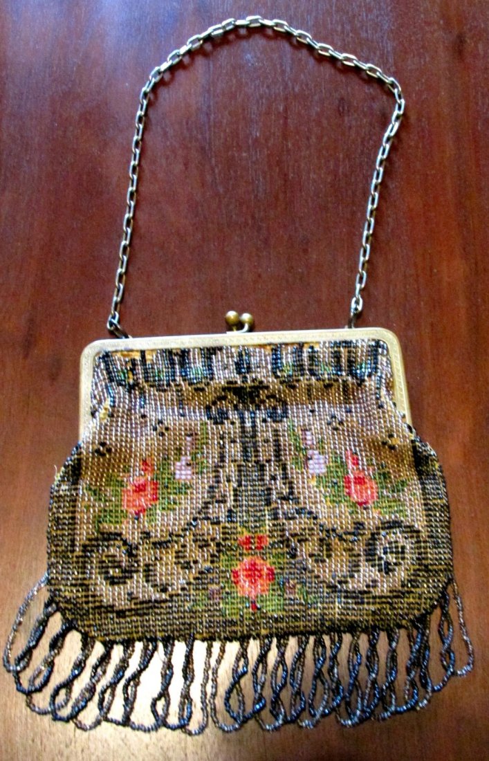 Fancy 1910 Beaded Purse Floral & Nouveau Design: 1890-1910 era, hand beaded with Art Nouveau scrolling and floral design, beaded fringe, chain handle, minor bead losses, the liner is in good condition, 6 1/2" wide by 7" long plus the chain.