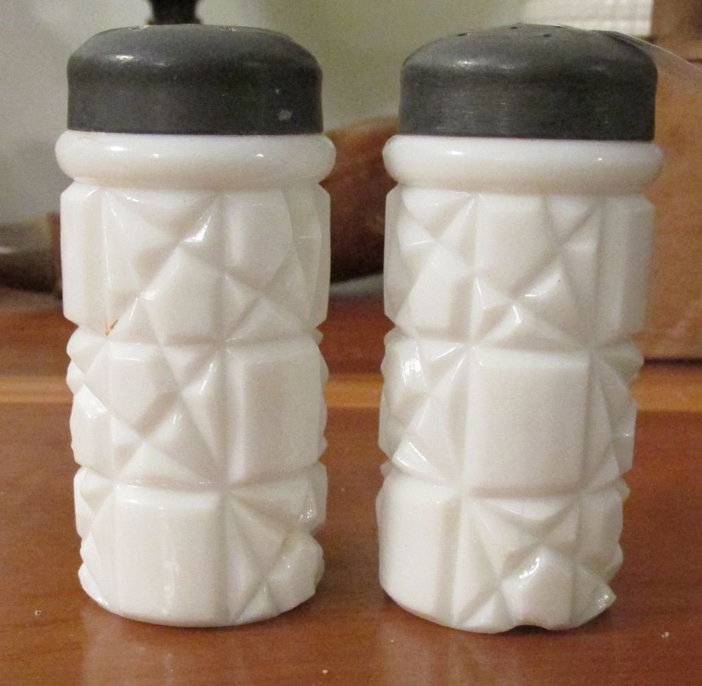 Pr. Milk Glass Salt & Peppers: 1880-1910, original lids, molded designs, 3" tall by 1 1/2" wide.