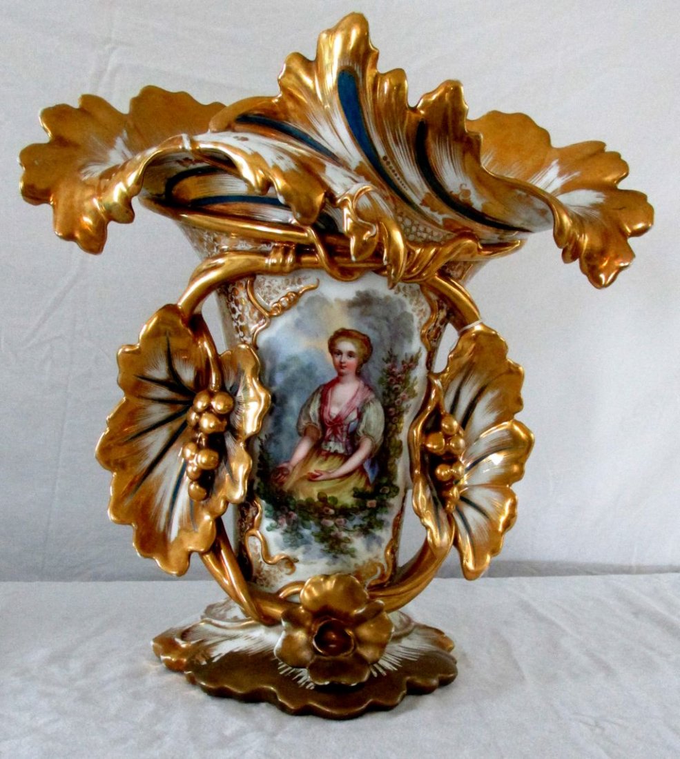 19th Cent. Old Paris Porcelain Vase: Early to mid 19th Cent., unsigned, but not doubt, Old Paris, leaf and swirl design with grape clusters in gilded designs around the front of the vase, a hand painted, attractive woman is shown in a ga