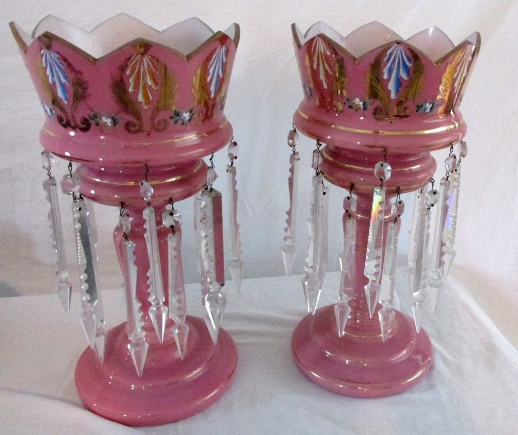 Pr. Pink Overlay Lusters: Ca. 1850-70, hand painted medallions of leaves with gold trim around the top, pink overlay over white glass, hand blown, all prisms seem to be intact and there. 15" tall by 7 1/4" wide.