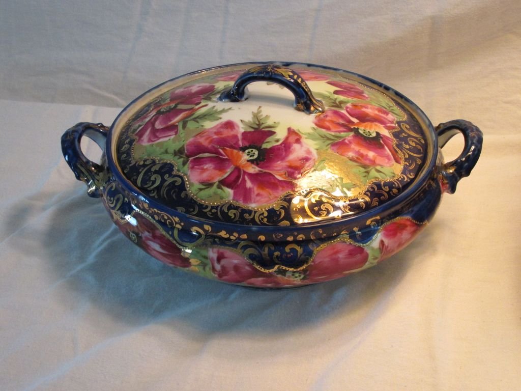 Nippon Covered Vegetable Bowl: Cobalt blue trimmed, applied double handles, lots of gold hand painting, unsigned, 1900-1920 era. 3 1/2" tall by 10" wide from handle to handle