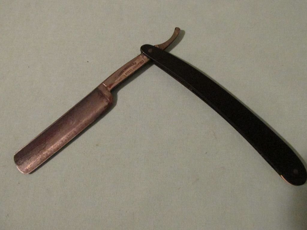 John Williams Steel Sheffield Straight Razor: Ca. 1900-1920 ebonized bakelite handle, John Williams Steel Sheffield Straight Razor closed - 6 1/8" : open - 9 1/4"