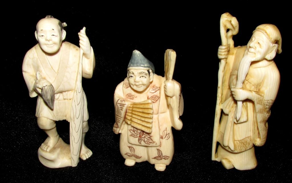 3 Netsuke's: Three carved netsuke's of uncertain age but likely to be last half of the 20th century, all three have signatures on the base, all are sages of some sort. From 2 1/2" tall to 3 1/4" tall.