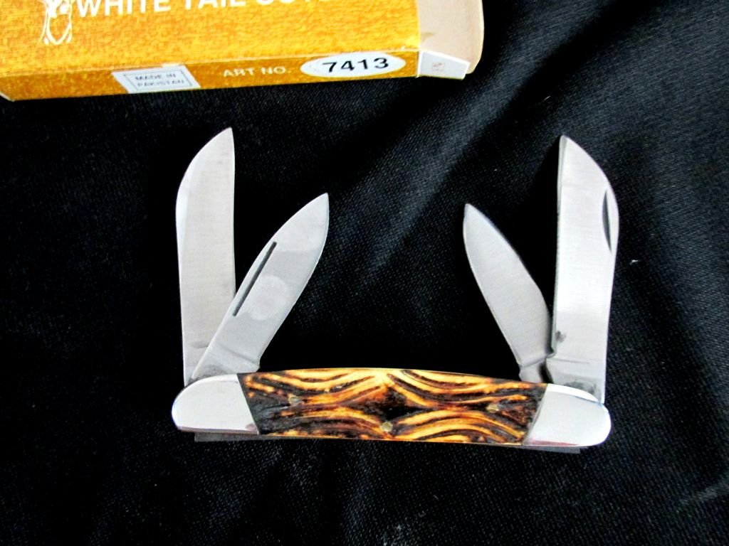 White Tail Cutlery Pocket Knife MIB: Could not be in better condition, still in original box, White Tail Cutlery, 4 blades, No. 7413. 4 1/2" long when closed.