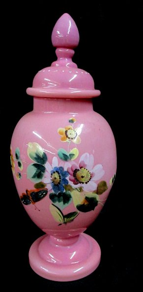 Cased Glass Ginger Jar 1850: Hand blown white with pink overlay cased glass, hand painted floral design on the front, original lid, no damage, 12 1/2" wide to the top of the finial 4 1/2" wide, circa 1850-75.