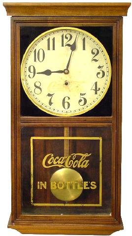 Coca-Cola Wall Clock: Mahogany Finished Fruitwood Or Poplar Case, This Reverse Painted Black w/Gold Circle Around Face & Base Tablet w/Coca-Cola In Bottles In Gold Appears To Be All Original, Noted On Face Bottom, Made In