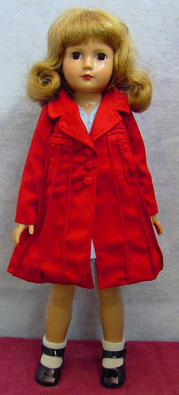 EFFANBEE American Children doll: 18 1/2 in. tall plastic socket head on a plastic body. She has brown sleep eyes, upper lashes and painted lower lashes, closed mouth she is jointed at the shoulders and hips, she has a brown synthetic