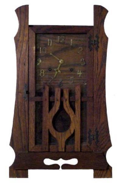 Mission Oak Mantel Clock: Circa 1910, This Old If Not Original Finished Oak Mission Style American Clock Is Unknown As To The Maker, Almost A Stylized Lyre in The Front Door, Brass Letters On The Oak Face, 20 1/2 Tall by 12 1/