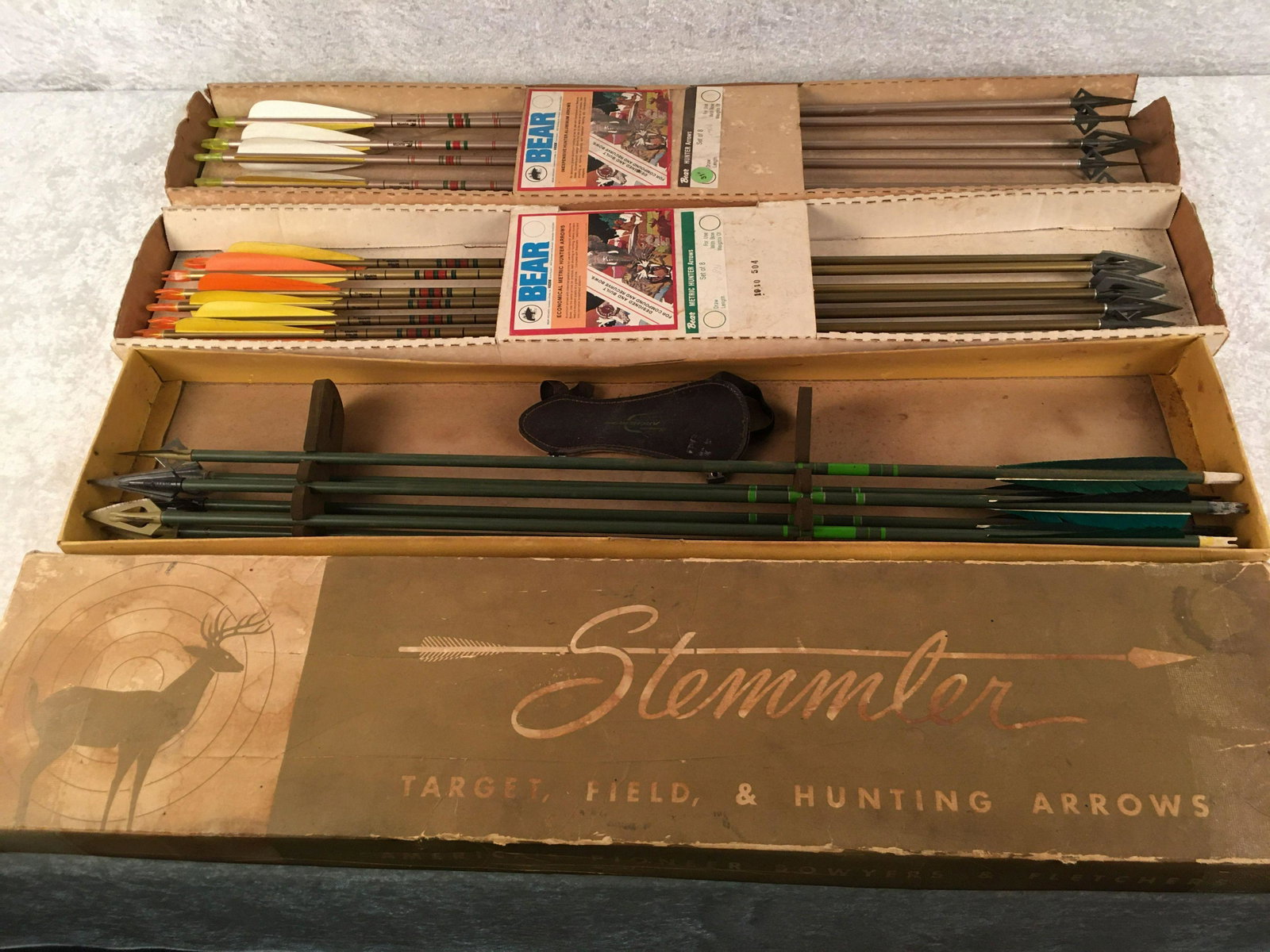 Vintage Group of (18) Arrows. (11) Aluminum Bear Metric: Vintage Group of (18) Arrows. (11) Aluminum Bear Metric Hunter Arro (3) Bear Razorheads, (3) Hilbre & Arm Guard ws: (10) Bear Razorheads, (1) Field Point. (6) Green Wood Arrows with Broadheads 29": (3