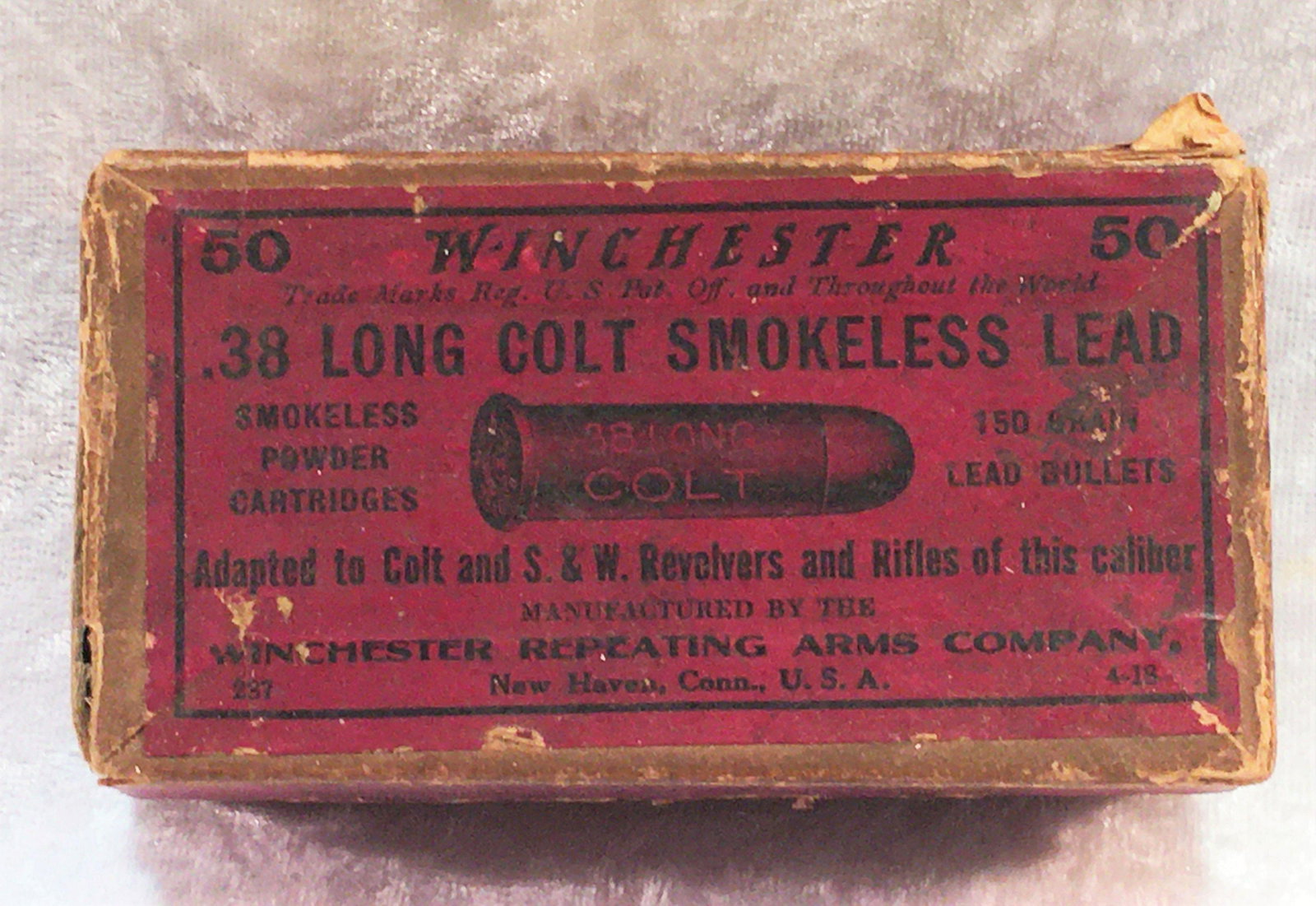 Vintage Winchester .38 Long Colt Smokeless Lead Two: Vintage Winchester .38 Long Colt Smokeless Lead Two Piece Full Box of Empty Brass, (1) Loaded Cartridge. 150 Gr. Lead Bullets. Adapted to Colt and S&W Revolvers and Rifles of this Caliber. One Side of