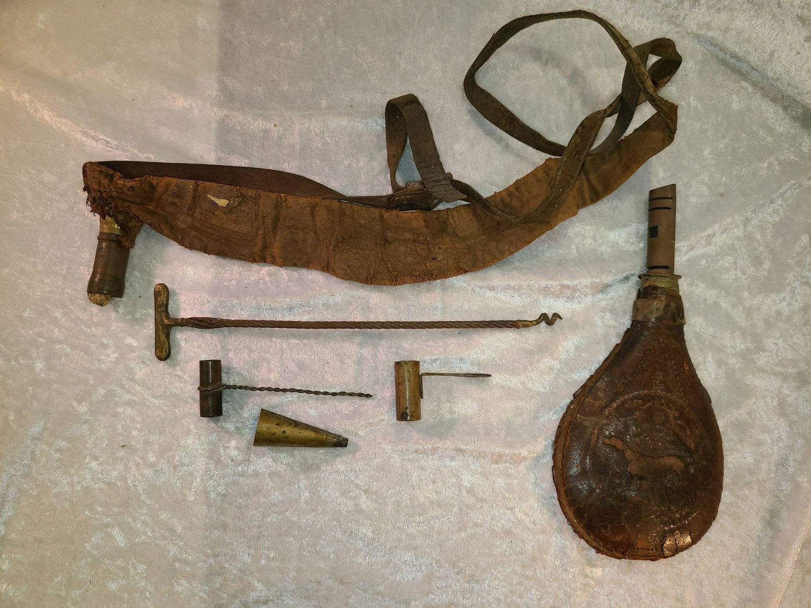 Lot of (5) Reloading Tools. To Include (2) Small Brass: Lot of (5) Reloading Tools. To Include (2) Small Brass Powder Measures, Brass Funnel, Primitive Bullet Worm W/Brass T Handle, Leather Shot Sling, & Shot Pouch in Leather W/Pointer Dog (Rough Condition