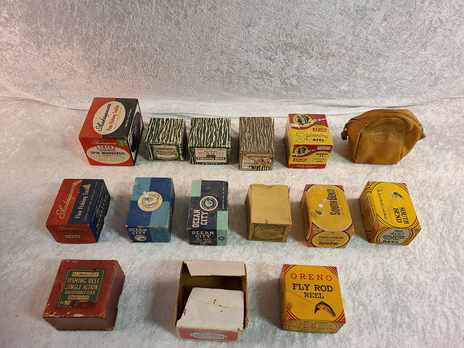 Lot of (15) Vintage Fishing Reel Empty Boxes. Charles: Lot of (15) Vintage Fishing Reel Empty Boxes. Charles Garcia & Co. Leather Zip Bag, Ocean City , Empire City Fishing Tackle, Pflueger Progress 1774, Medalist 1494, Akron 1893, South Bend Perfectoreno 