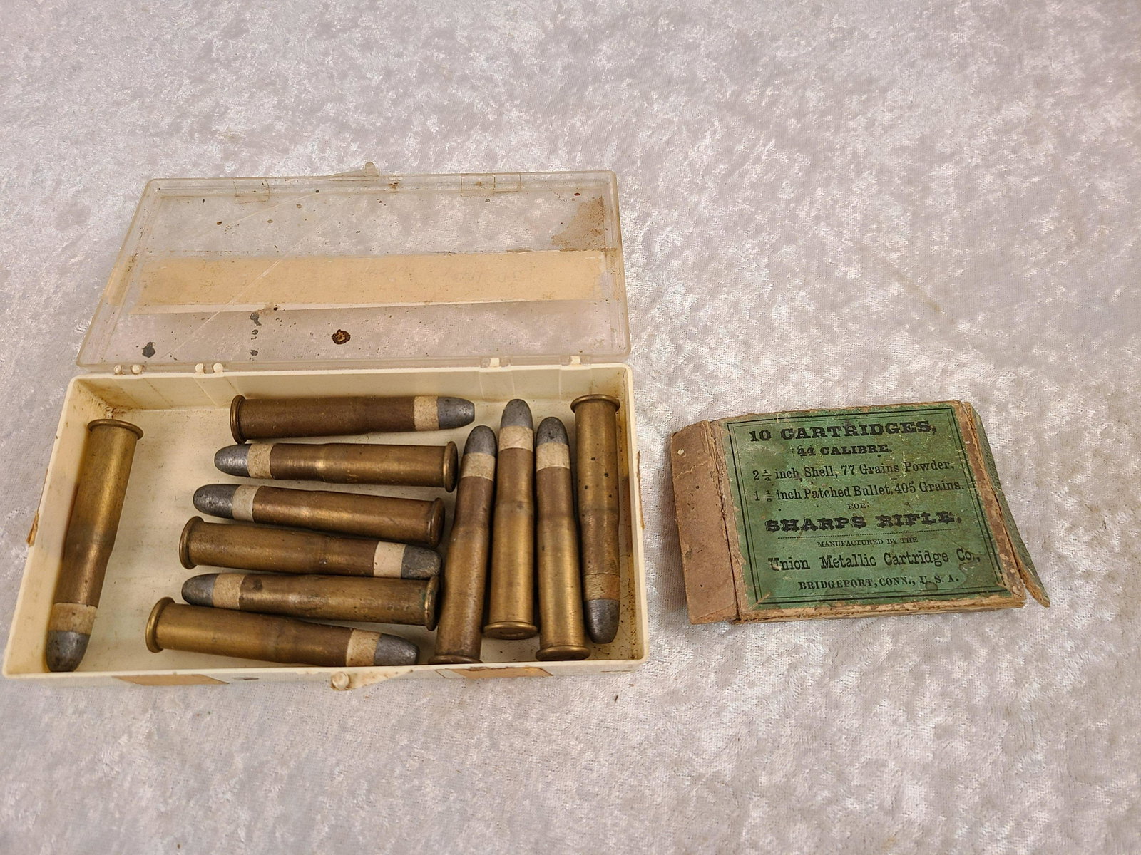 Vintage Union Metallic Cartridge Co. 44 Cal. Sharps: Vintage Union Metallic Cartridge Co. 44 Cal. Sharps Rifle Box Lid Only with (11) Cartridges. Lid Split at Seams. 2 1/4 " Shell, 77 Gr. Powder, 1 1/8 in. Patched Bullet, 405 Gr.