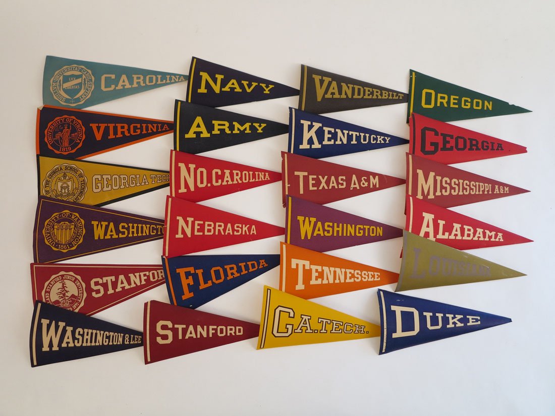 (24) College Paper Decal Pennants 6" Unused: Lot of 24 Paper Decal College Pennants. Unused Adhesive on Back. Approx. 6"