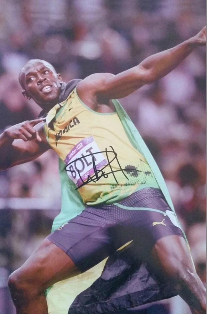 USIAN BOLT SIGNED PHOTO.: A signed photo of Usian Bolt. 18x24 inches.