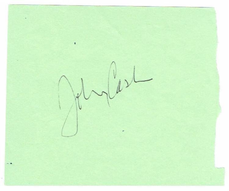 JOHNNY CASH SIGNED PAPER.: A piece of paper signed by country legend 'Johnny cash'