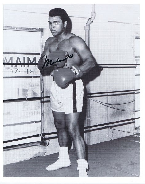MUHAMMAD ALI SIGNED PHOTO.: MUHAMMAD ALI was an American Olympic and professional boxer and activist, widely regarded as one of the most significant and celebrated sports figures of the 20th century. From early in his career, Al