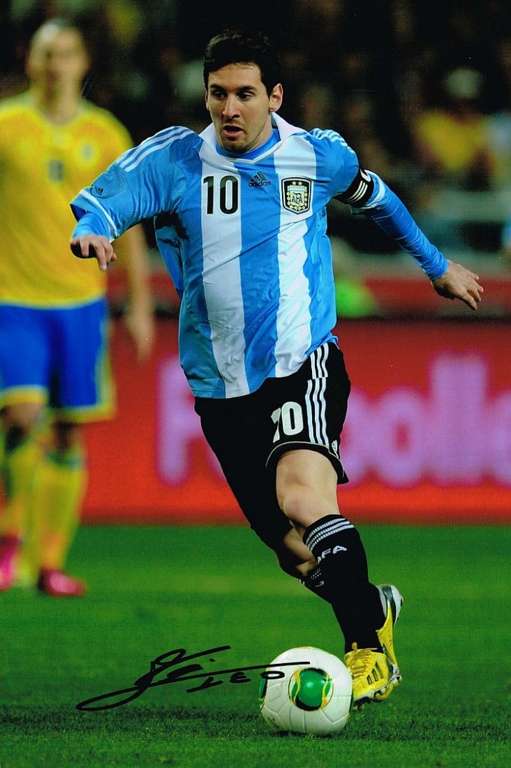 LIONEL MESSI SIGNED PHOTO.: LIONEL MESSI SIGNED PHOTO. 12X8 INCHES. Lionel is an Argentine professional footballer who plays for Spanish club FC Barcelona and the Argentina national team as a forward, and is also the captain of