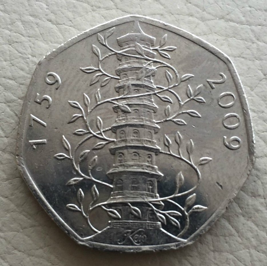 KEW GARDENS 50P COIN.: The Kew Gardens British coin: The unusual commemorative 50p piece went into circulation in 2009 to mark the 250th anniversary of the Royal Botanic Gardens at Kew. Designed by Christopher Le Brun, show