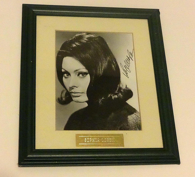 SOPHIA LOREN SIGNED PHOTOGRAPH.: SOPHIA LOREN: A black and white photograph signed by Sophia Loren in black marker presented in a frame. Supplied with coa from MTR consultancy of England.