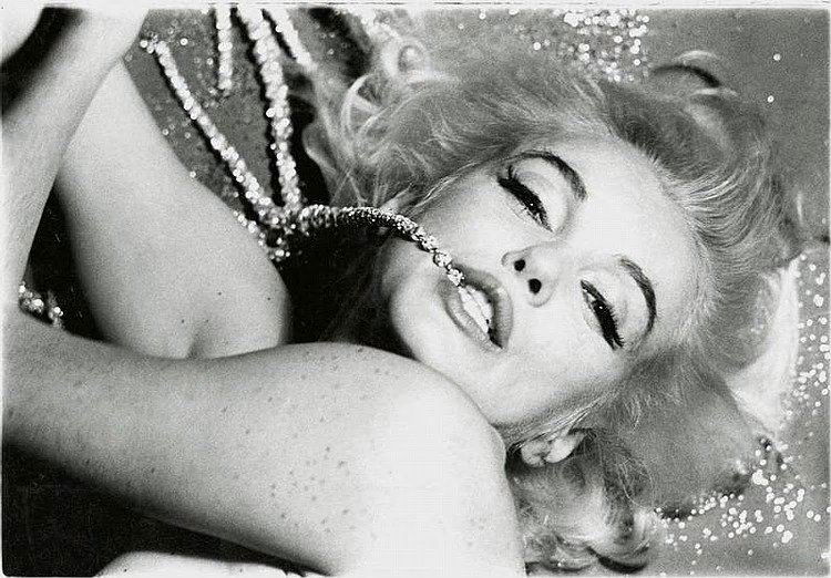 BERT STERN: MARILYN MONROE BITING THE RHINESTONES.: BERT STERN: MM BITING THE RHINESTONES. 12X17 inches. Heavy archival matte photo paper. Pigment print. Edition: of 36. Printed between 2011-2013. Copyright stamped on the verso. Bert stern signed. Cond