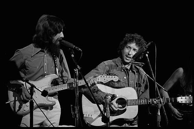 BILL RAY SIGNED: DYLAN/HARRISON AT BANGLADESH CONCERT.: BILL RAY: Bob Dylan and George Harrison on stage at Madison Square Gardens for the Bangladesh benefit concert in 1971. Bill Ray signed silver gelatin print. 16x20 inches. Edition of 50. Condition Repo