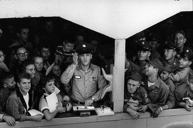 ELVIS WAVES GOODBYE '58. BILL RAY SIGNED SILVER GELATIN: BILL Ray: Taken as Pvt Elvis Presley left for Germany from Brooklyn Naval yard. On assignment for Life Magazine. Silver gelatin later print. 16x20 inches. Signed by Bill Ray. Obtained directly from Bi