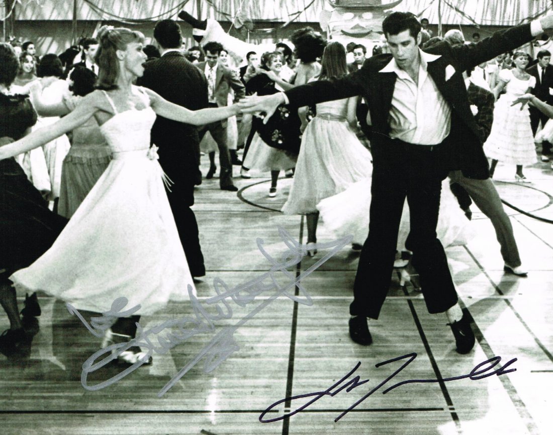 JOHN TRAVOLTA/OLIVIA NEWTON JOHN SIGNED.: Double signed Greece photo from John and Olivia. 10x8 inches.