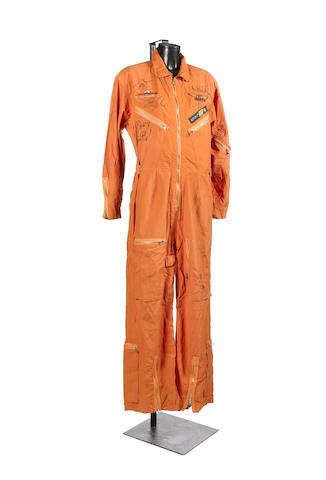 AEROSMITH SIGNED.: An autographed Aerosmith/Armageddon jumpsuit, a DKNY bright orange Armageddon The Album suit signed by the band in black marker.Obtained from Bonhams, Knightsbridge, London. England.Lot 344. 3rd July