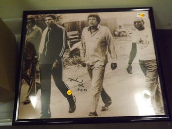 Framed Photo Autographed by Muhammad Ali. Appraised or: Framed Photo Autographed by Muhammad Ali. Appraised or estimated retail value $1800. COA by Christopher Morales.