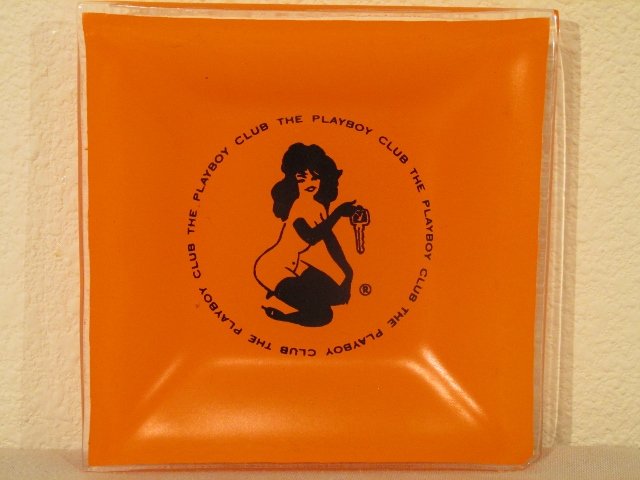 1960's Playboy Club playmate key Vintage Orange Ashtray: 1960's Playboy Club Vintage Ashtray depicting playmate with key. Orange and in very nice shape. Measures 3 and 3/4 inches