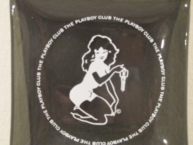 1960's Playboy Club playmate key Vintage Ashtray: 1960's Playboy Club Vintage Ashtray depicting playmate with key. Smoke colored and in very nice shape. Measures 3 and 3/4 inches