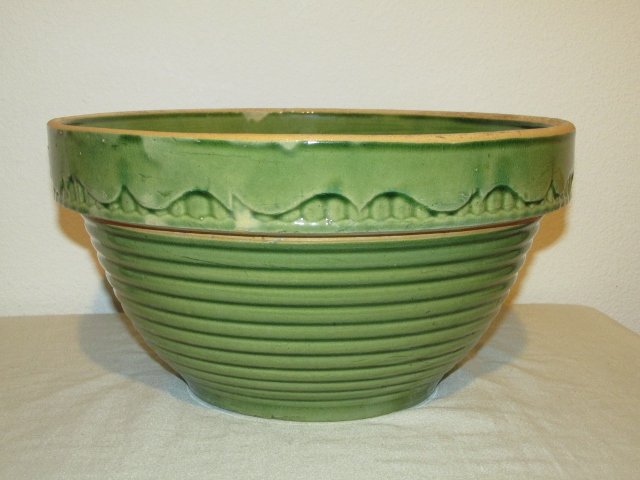 Large Yellow Ware mixing bowl Green Glaze: Fabulous Green glazed large Yellow ware mixing bowl. This bowl was most likely made by McCoy pottery is unmarked but incised with 11 on the bottom. This is not a very common pattern. Fantastic Green 1