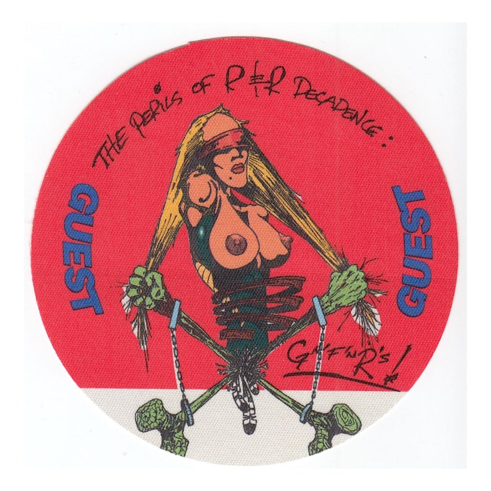 Guns N Roses - Perils of Rock N Roll Tour - 1991 - 1992 Backstage Pass: GUNS N ROSES (American Hard Rock Band) Authentic 1991 - 1992 Perils of Rock N Roll Tour Unused Guest Backstage Pass. Manufactured By: OTTO Includes COA. Dimensions: 3 3/4 inches round Shipped Flat