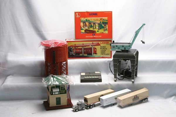 Lionel Accessories 110 trestle set (Postwar), 225: 110 trestle set (Postwar), 2256 station platform, 2324 switch tower, 6509 depressed center flat car with girders, 12755 elevated trestle set, 12914 SC-1 switch and accessory controller, 12916 water to