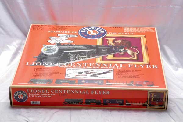 Lionel Train Sets 21976 Lionel Centennial Flyer f: 21976 Lionel Centennial Flyer freight set, 62048 Gold Rush battery operated set [Note: Only one set shown.] Gauge: O-27/G Item Quality: Q1 Box Quality: B2