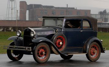 1931 Ford Model A Convertible Sedan: Specifications: 40bhp, 200.5 cu. in. 4-cylinder inline L-head engine, 3-speed manual transmission, solid front axle with transverse semi-elliptic leaf spring, live rear axle with transverse semi-ellip