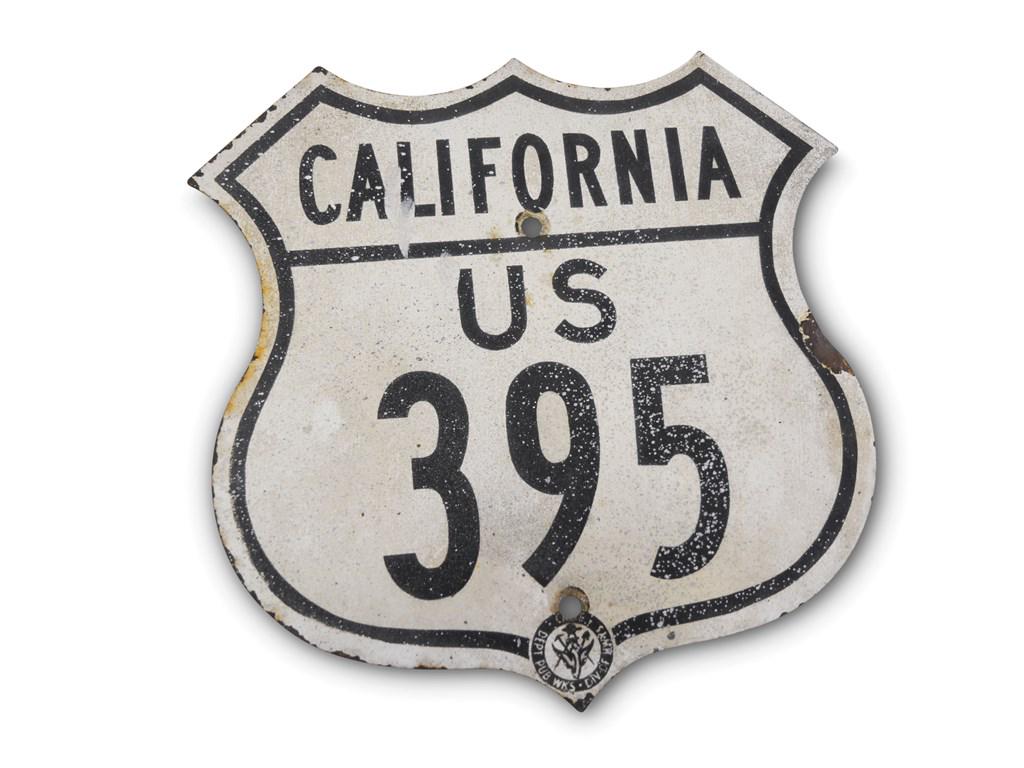 California U.S. Route 395 Shield Tin Sign: California U.S. Route 395 Shield Tin Sign SST Shield-Shaped Condition: 7.5 16 × 16 in. This sign is in good condition. It has paint over spray on it with chips around the perimeter. It is a flat sign