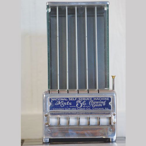 National Self-Service Vending Machine: An original example in very presentable condition, this tabletop machine dispenses mints and chewing gum for a nickel. (8x15x6")
