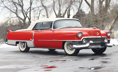 1954 Cadillac Eldorado Convertible: A restored and correct example finished in red with a matching red interior and white convertible top. This handsome Eldorado is optioned with power brakes, power steering, clock, and radio. It has be
