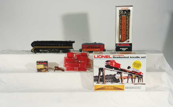 Lionel Preproduction Prototypes 8100 N&W "611" 4-: 8100 N&W "611" 4-8-4 steam locomotive (missing tender), 18419 Lionelville "8419" Electric Trolley, 2110 graduated trestle set, 12715 set of 2 illuminated bumpers, 12716 searchlight tower, assorted fre