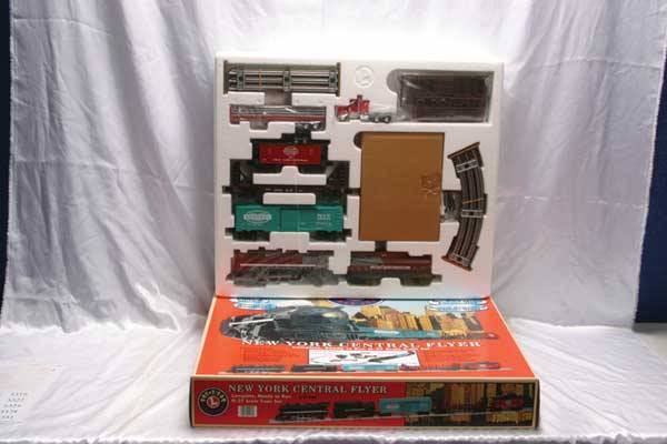 Lionel Train Set 21990 NYC Flyer freight set with: 21990 NYC Flyer freight set with RailSounds. Gauge: O-27 Item Quality: Q1 Box Quality: B3