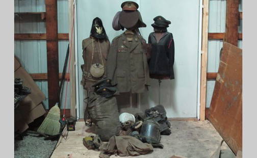 Military Paraphanalia: Lot includes a large selection of military uniforms, accessories, and some equipment.