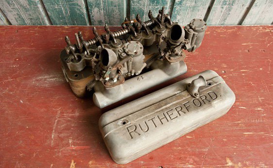 Speed Equipment: A Rutherford OHV conversion cylinder head for Ford Model B, including manifold and downdraft Winfield carburetors.