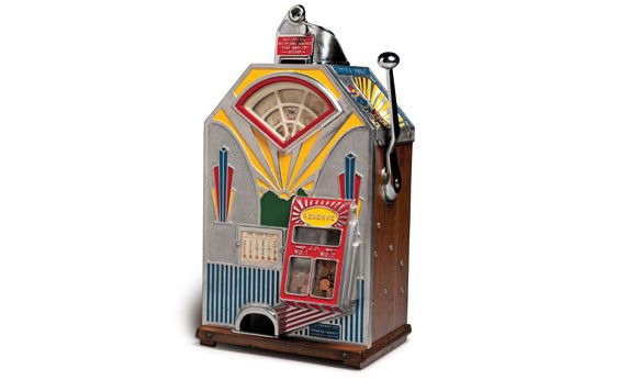 "Little Duke" Penny Slot Machine: OFFERED WITHOUT RESERVE Slot machine with a side-view panel of the coin operation as well as the locking wood rear cabinet with operation instructions. Notably a different humurous message is displaye