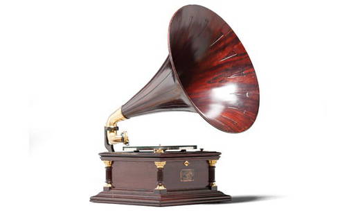 Victor Six Talking Machine: OFFERED WITHOUT RESERVEAn early example by virtue of its wooden horn, this talking machine retains its original stylus and features gilt columns in all corners. Both the horn and case are beautifully